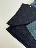 Navy quilted inner lining pieces with buttoned edges