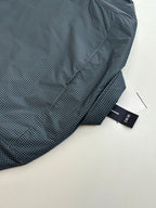 Checkered shirt fold detail with buttoned placket, dark teal