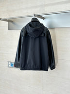 Black hooded jacket with full-zip front and gathered hem, shown from the back.