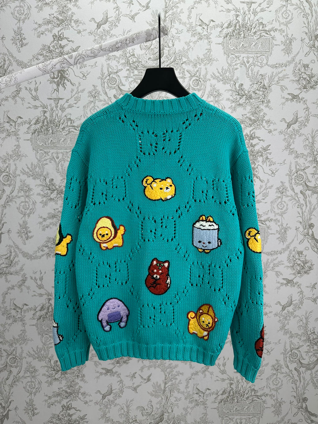 Turquoise knit sweater with cartoon animal appliques, crew neck, long sleeves