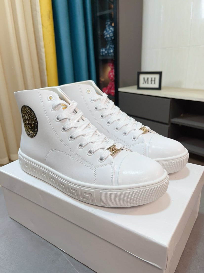 Pair of white lace-up high-top sneakers with logo patch and textured side stripe.