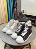 Pair of lace-up high-top sneakers with patterned uppers, white and dark colorways.