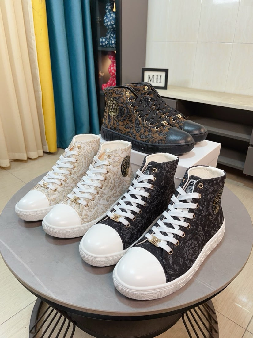 Pair of lace-up high-top sneakers with patterned uppers, white and dark colorways.