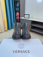 Two high-top sneakers with dark paisley uppers, shown from heel on shoe box.