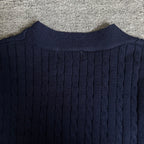 Navy cable-knit cardigan back with ribbed crew neckline