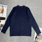 Navy cable-knit sweater/cardigan with ribbed hem and full-length sleeves