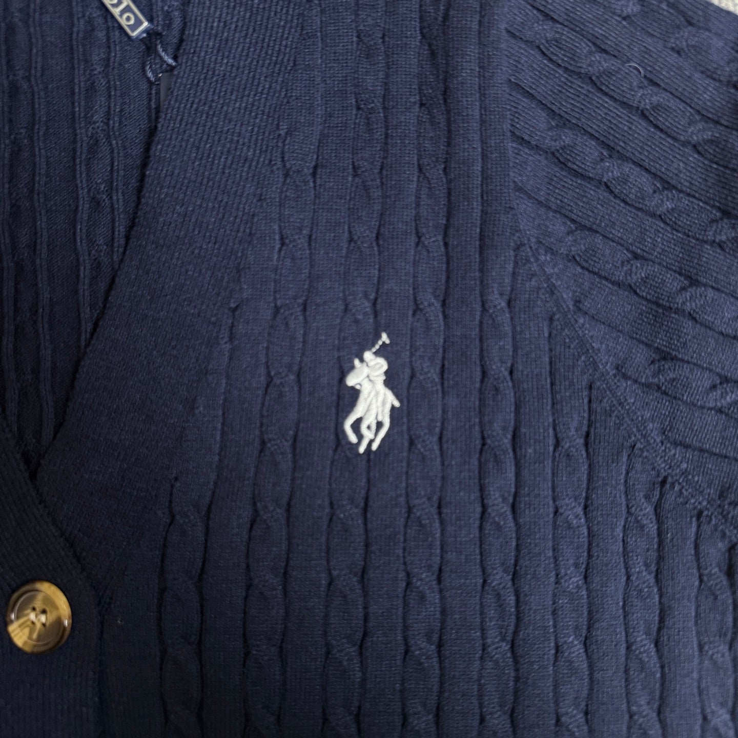 Navy cable-knit cardigan with embroidered polo horse emblem and button edge
