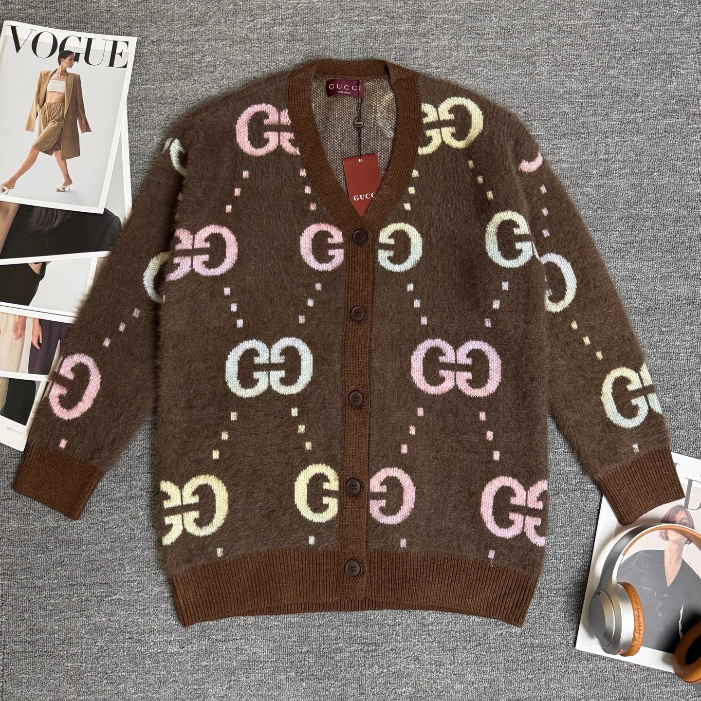 Brown Gucci logo knit cardigan with button front and long sleeves, GG pattern all over.