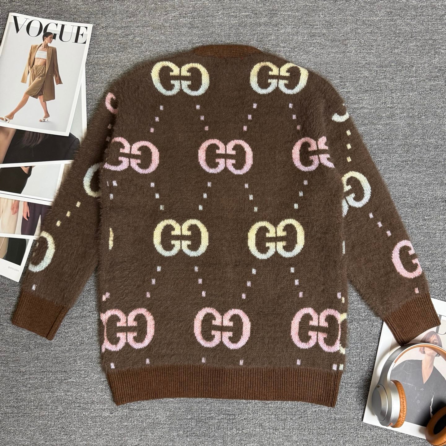 Brown Gucci logo knit cardigan back view with GG motifs and long sleeves, buttonless hem.