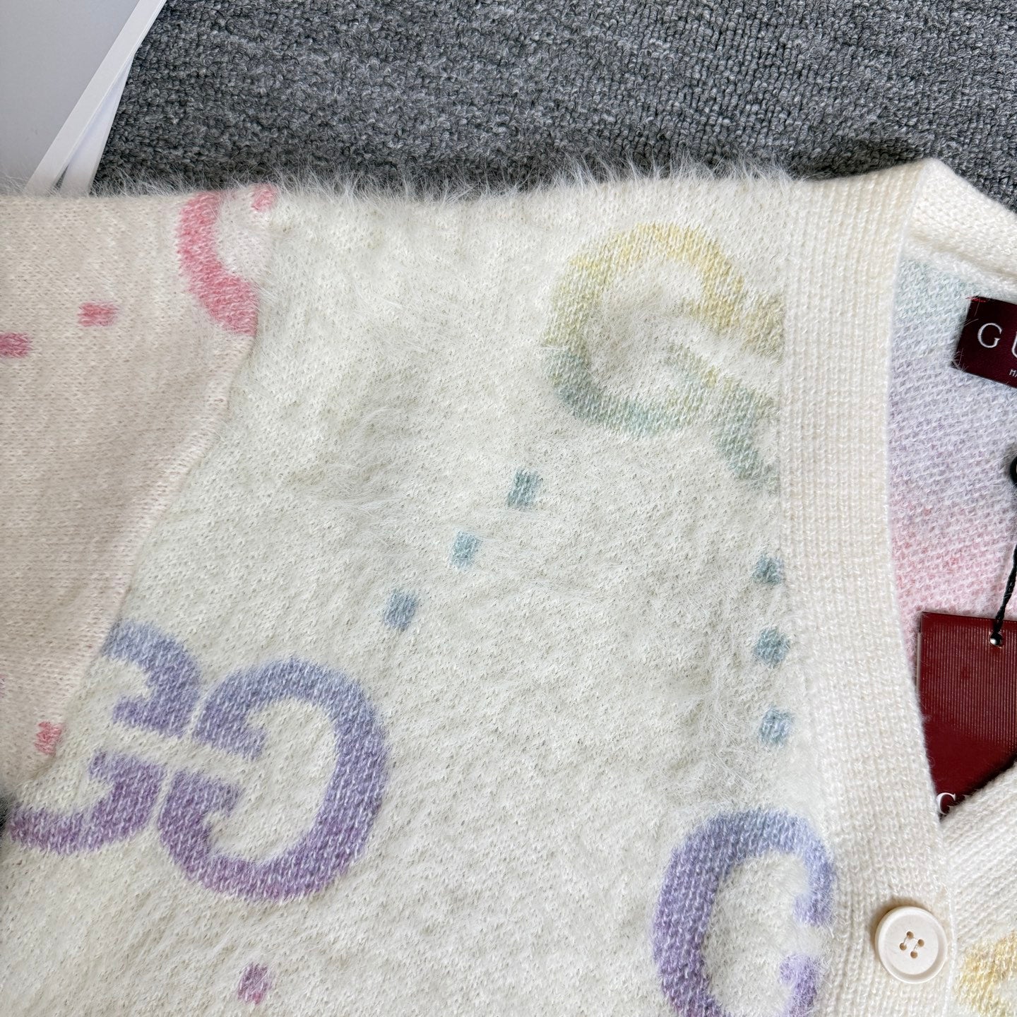 Gucci knit cardigan sleeve and front hem, off-white with large multicolor GG graphic