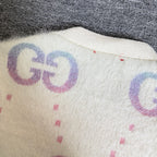 Gucci knit cardigan back detail, off-white knit with purple-blue GG graphic and speckles