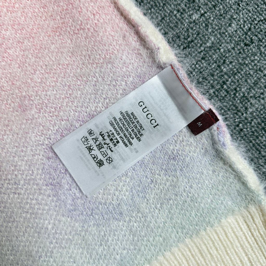 Gucci knit cardigan inside neck label on off-white knit near hem edge