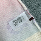Gucci knit cardigan inside neck label on off-white knit near hem edge