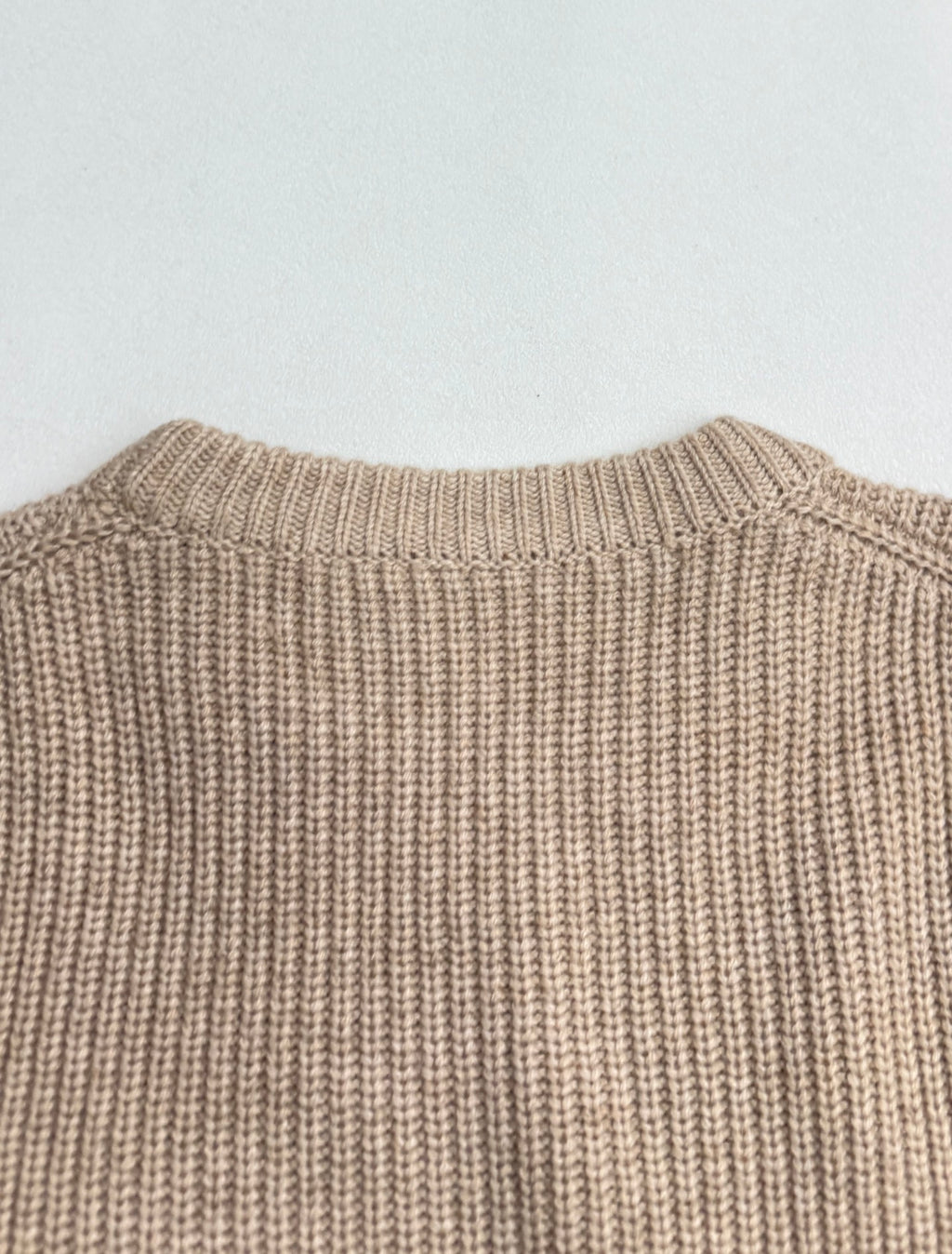 Beige knit sweater back with ribbed crewneck collar
