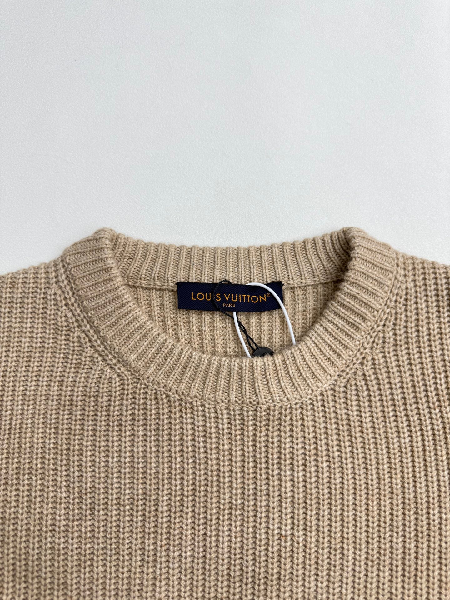 Beige ribbed crewneck sweater with Louis Vuitton neck label