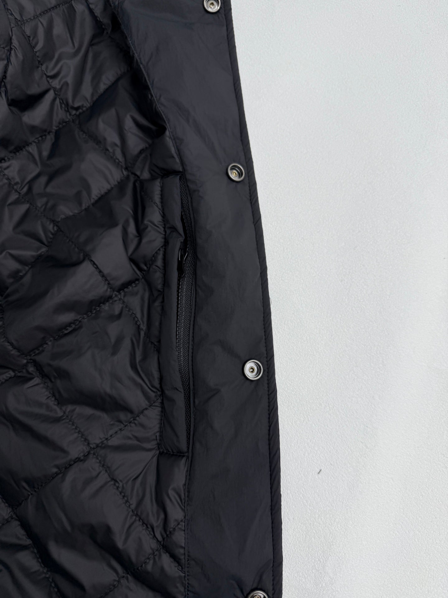 Ralph Lauren polo jacket side with snap buttons and quilted dark black shell