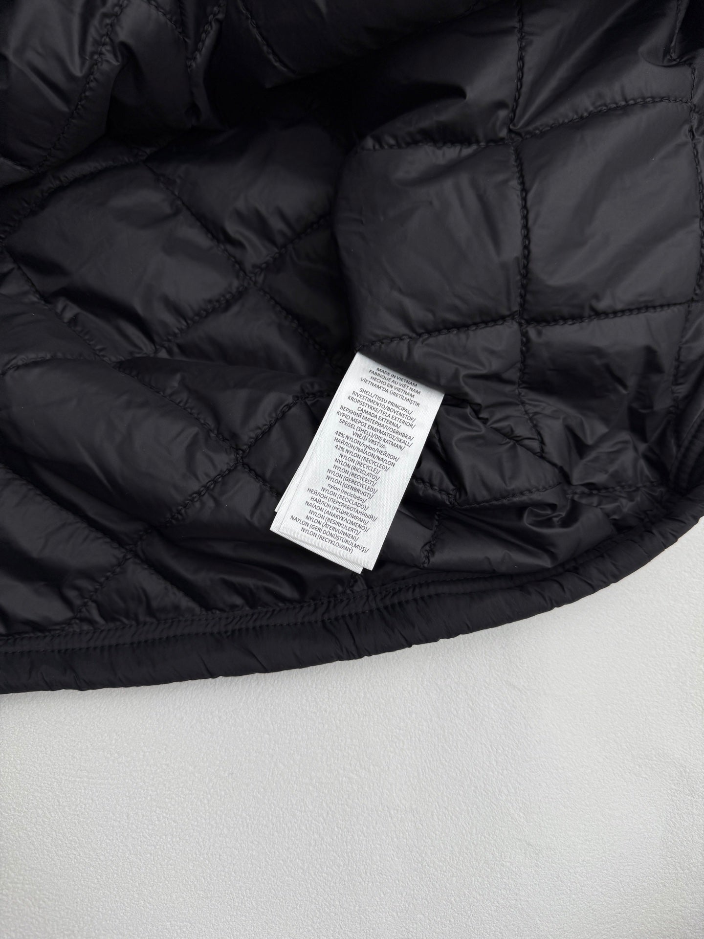 Ralph Lauren polo jacket interior with care label in dark black quilted lining