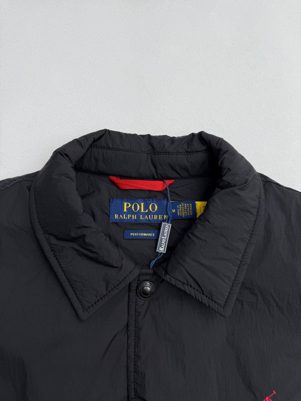 Ralph Lauren polo jacket collar and snap buttons in dark black with inner label