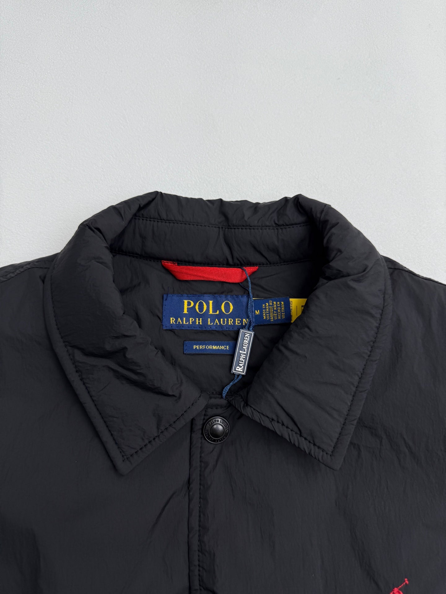 Ralph Lauren polo jacket collar and snap buttons in dark black with inner label