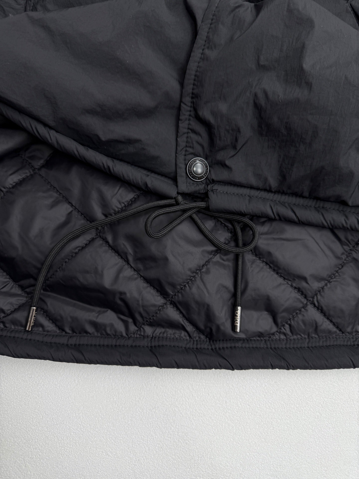Ralph Lauren polo jacket hem with drawstring and metal snap button in dark black