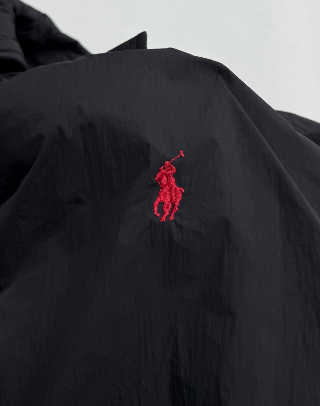 Ralph Lauren polo jacket with red embroidered pony logo on dark black chest