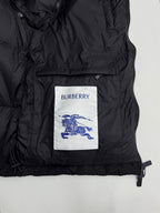 Black long puffer jacket front panel with Burberry logo patch and zip