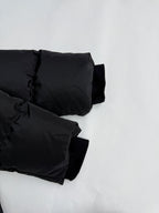 Black puffer jacket sleeve cuffs with elastic at wrist openings