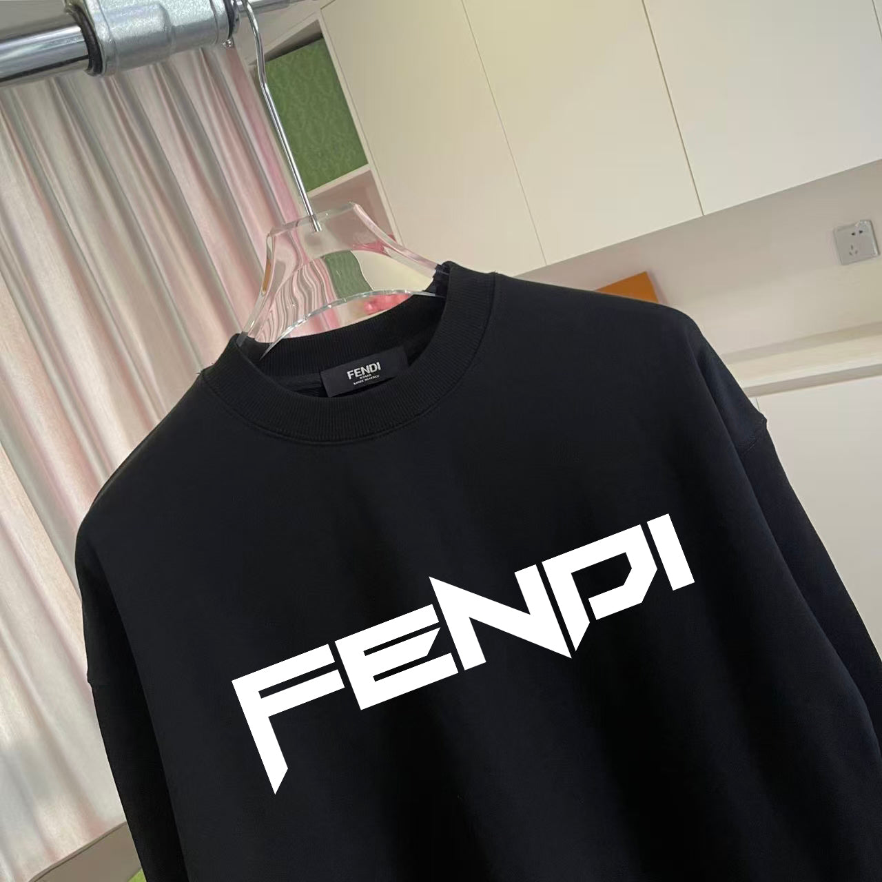 Black crewneck sweatshirt with FENDI logo text on chest
