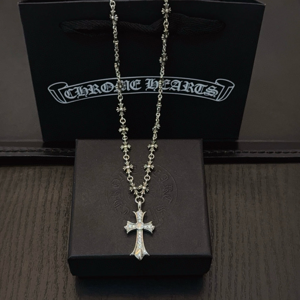 Silver-tone cross pendant necklace with floral beaded chain links
