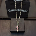 Silver cross pendant necklace with chain and pink enamel accents