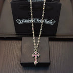 Silver cross pendant necklace with chain and pink enamel accents