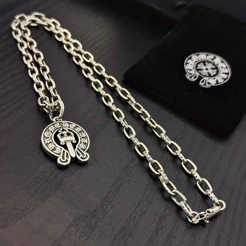 Chrome pendant necklaces with round cross emblem pendants on silver-toned chain