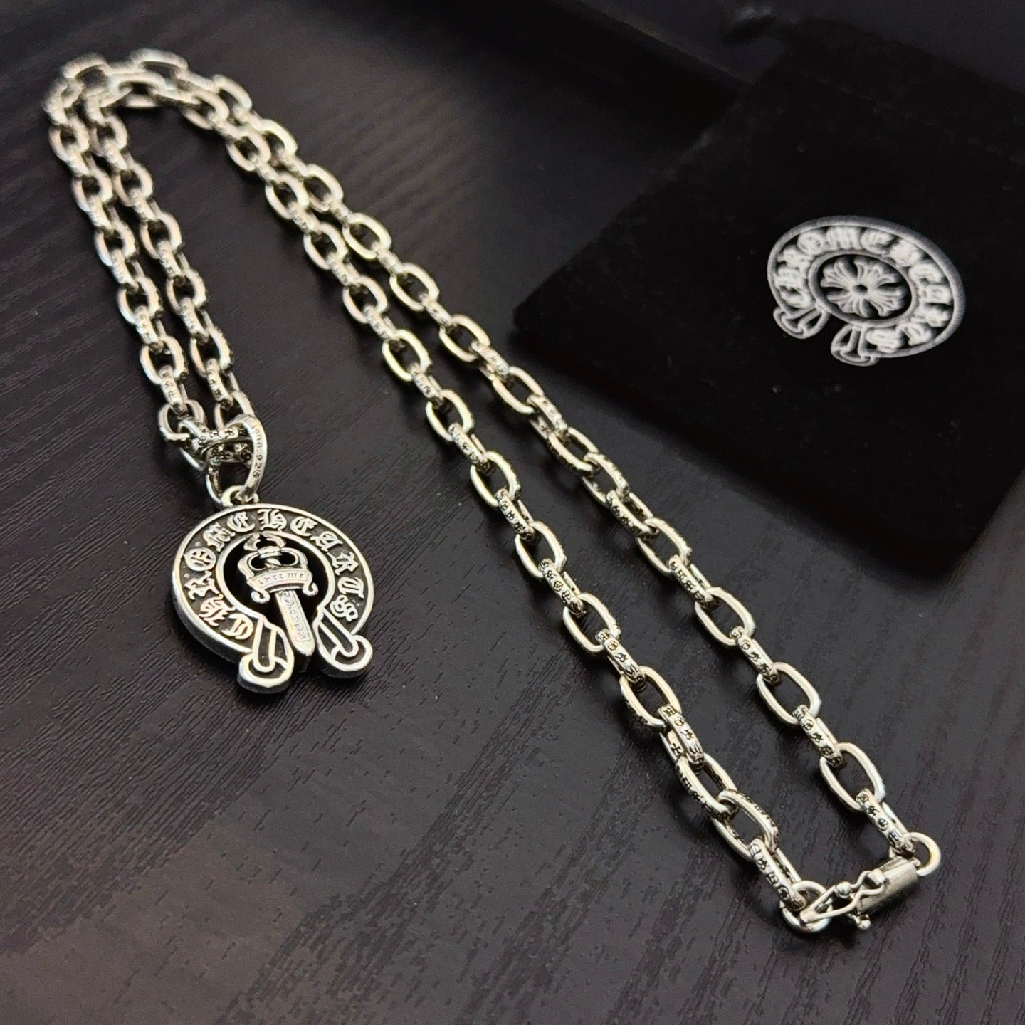 Chrome pendant necklaces with round cross emblem pendants on silver-toned chain