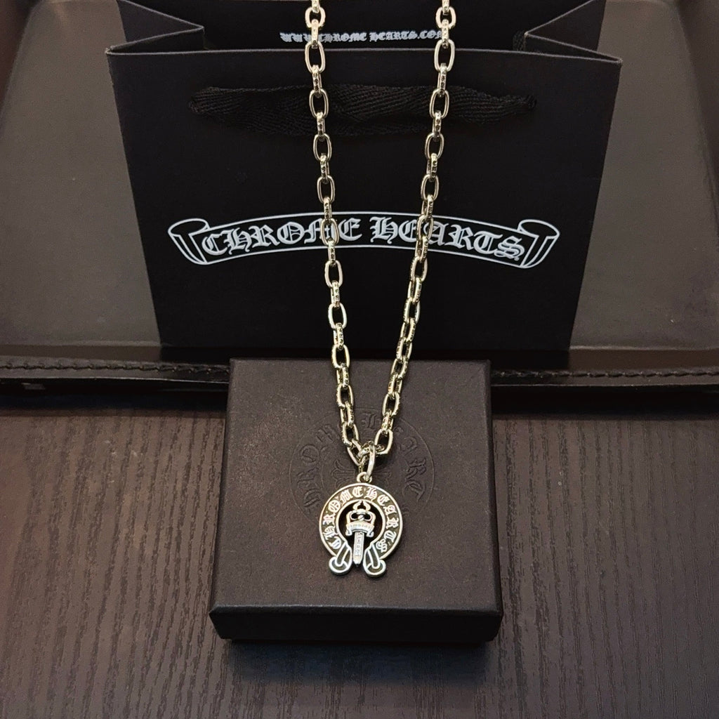 Chrome pendant necklace with round cross emblem pendant on silver-toned chain