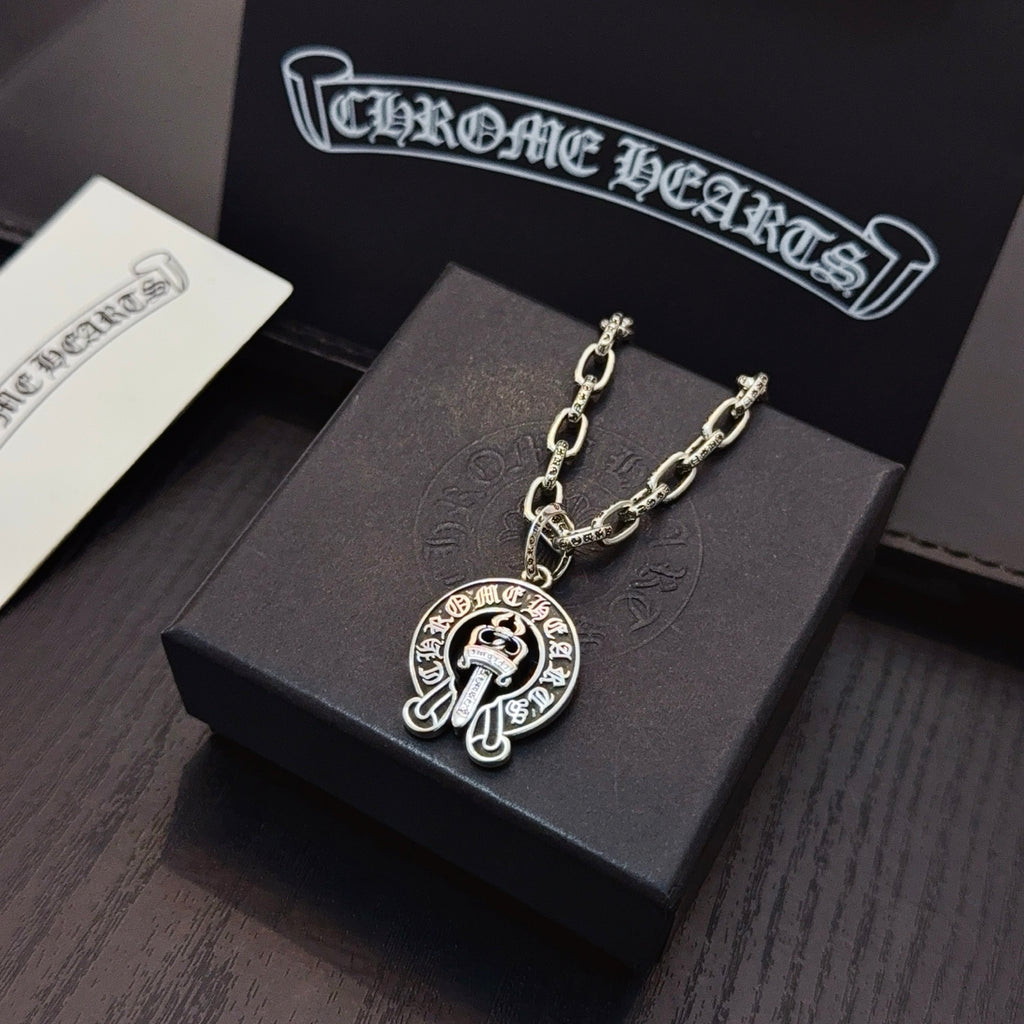 Chrome pendant necklace with round cross emblem pendant on silver-toned chain links