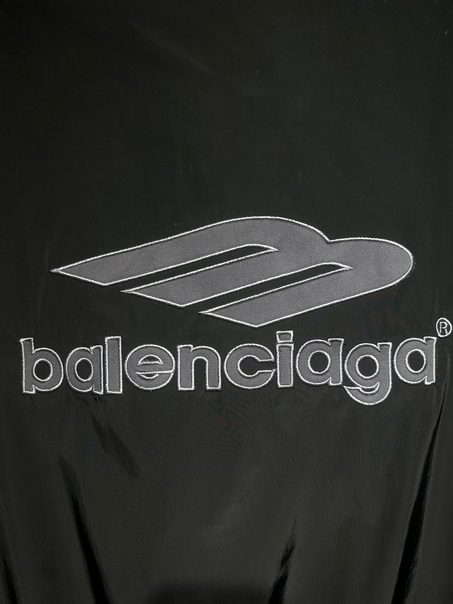 Black track jacket front with large Balenciaga logo print