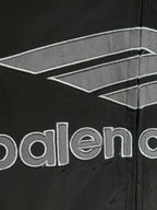 Black jacket sleeve with Balenciaga logo and stitched panel details