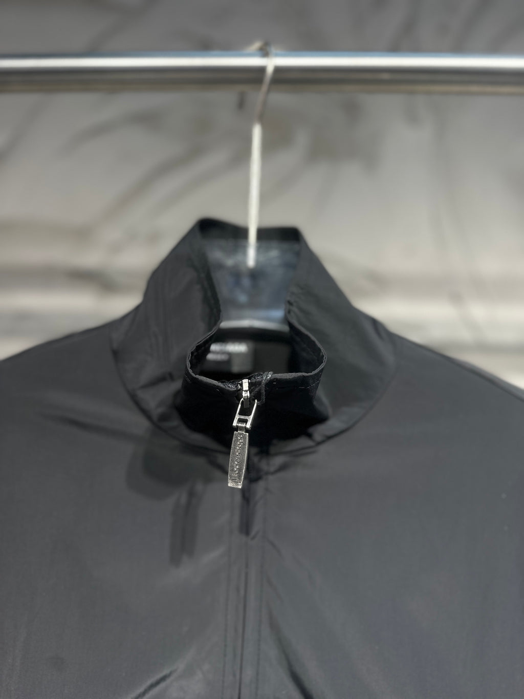 Black jacket with stand collar and central front zipper