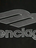 Black track jacket with embroidered Balenciaga logo and graphic lines
