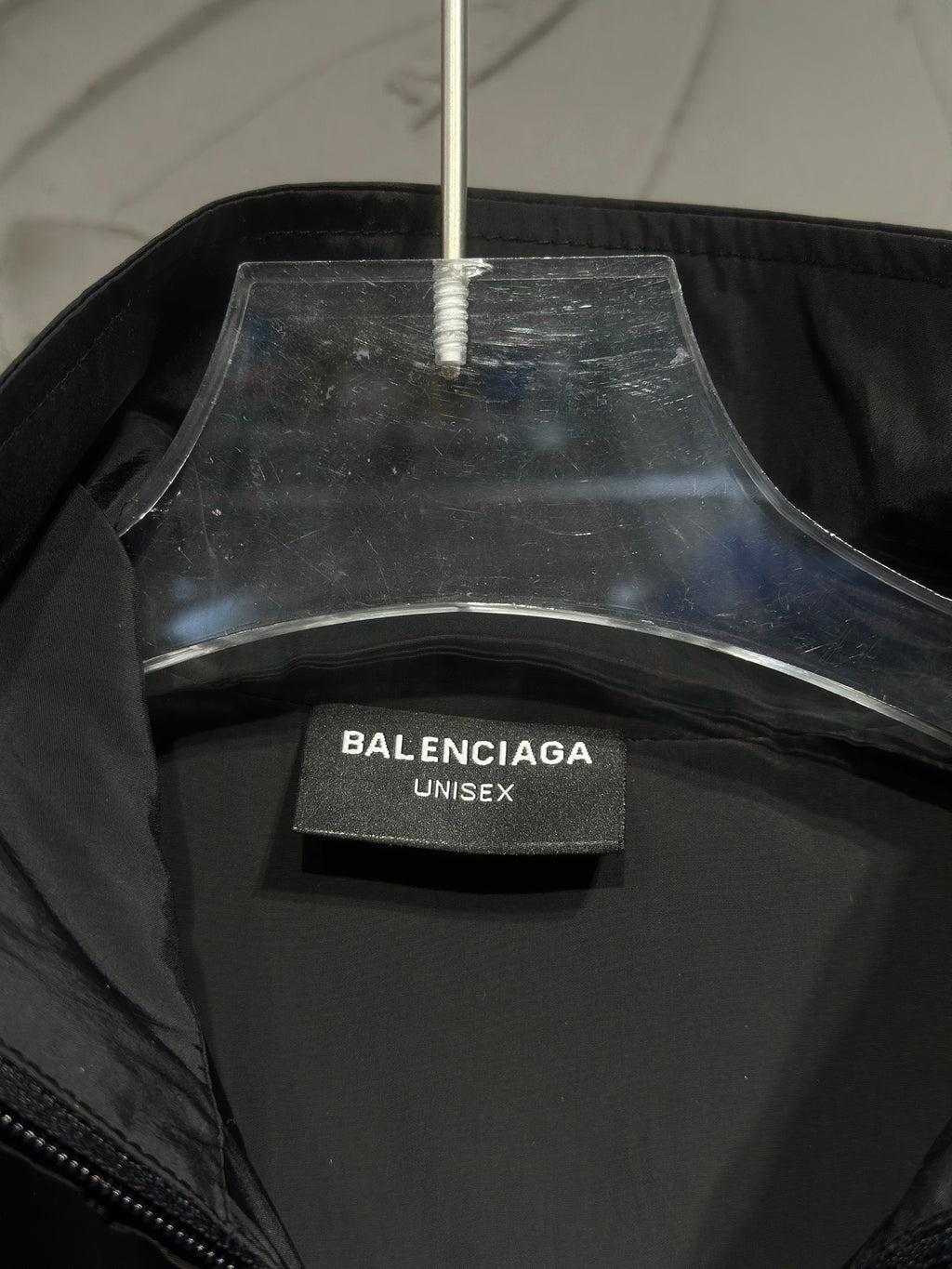 Black jacket with Balenciaga lining label and exposed neck tag