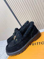 Dark suede shearling loafer shoes with gold logo hardware and rugged rubber sole