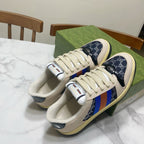 Gucci unisex lace-up sneakers, cream uppers with navy side panels and stripe trim