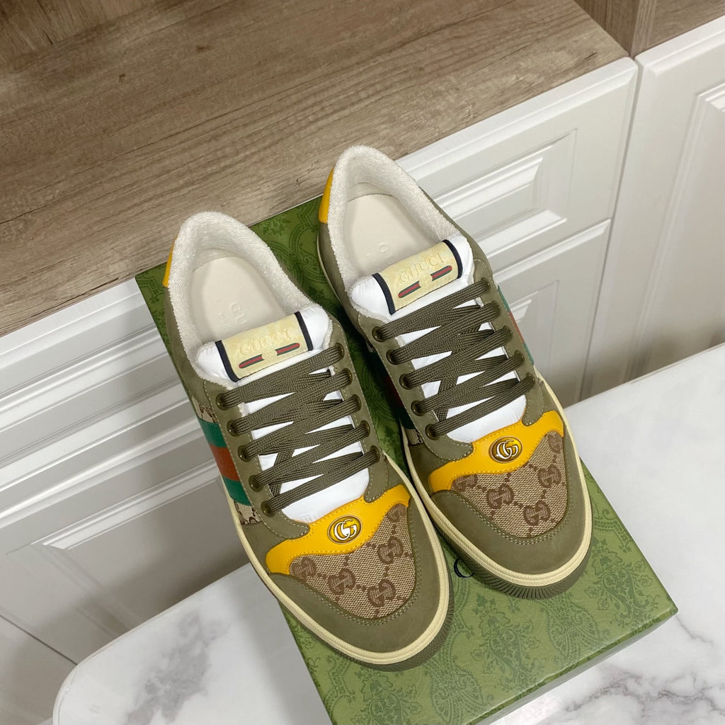 Low-top unisex sneakers with olive uppers, GG trim, multicolor stripe, and lace-up design