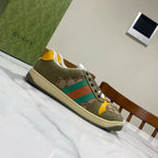 Low-top unisex sneakers in olive canvas with GG pattern panels, multicolor stripe, lace-up