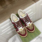 Gucci unisex sneakers, burgundy suede with GG canvas, lace-up eyelets, and gold emblem