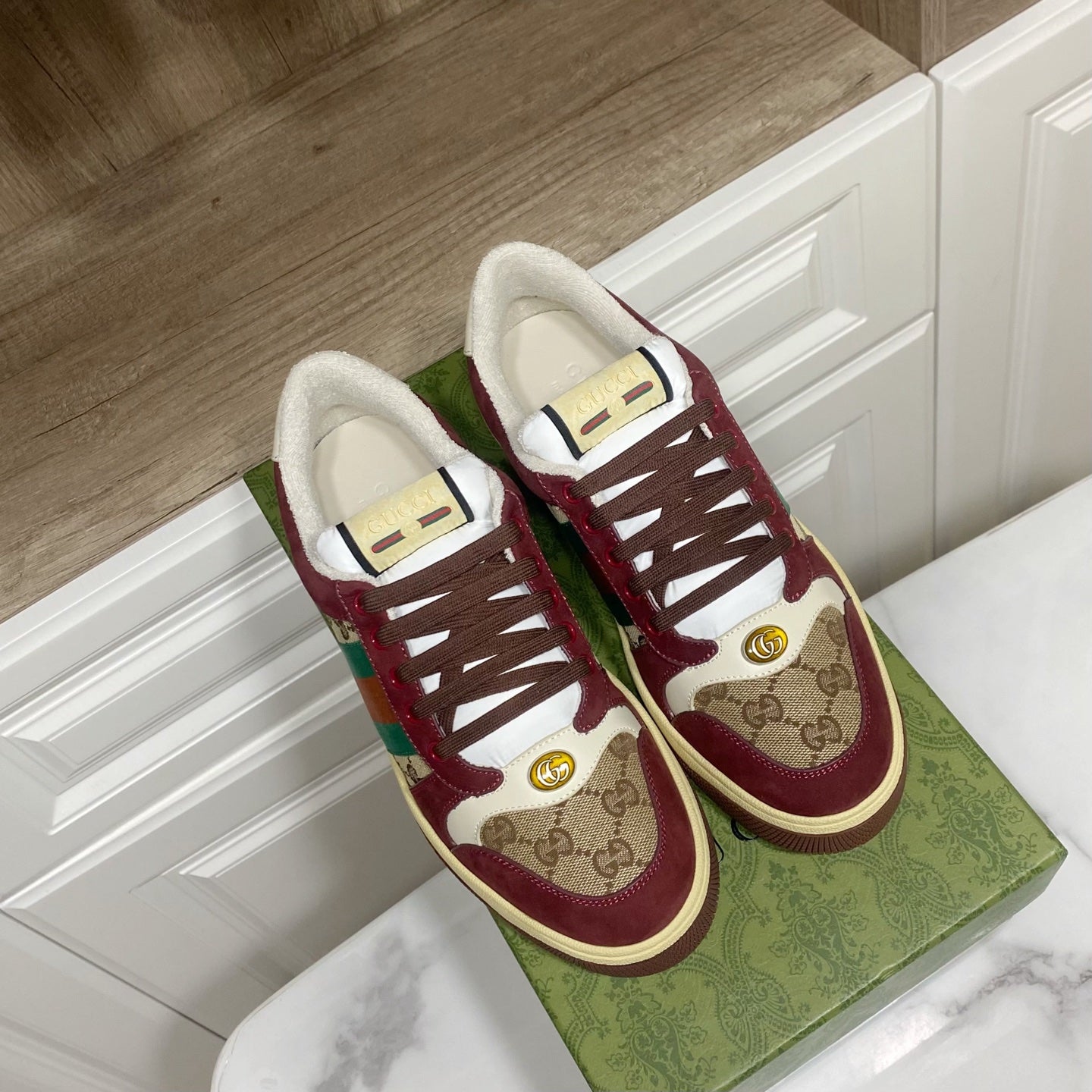 Gucci unisex sneakers, burgundy suede with GG canvas, lace-up eyelets, and gold emblem