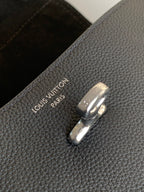 Black leather handbag with Louis Vuitton engraved magnetic clasp hardware