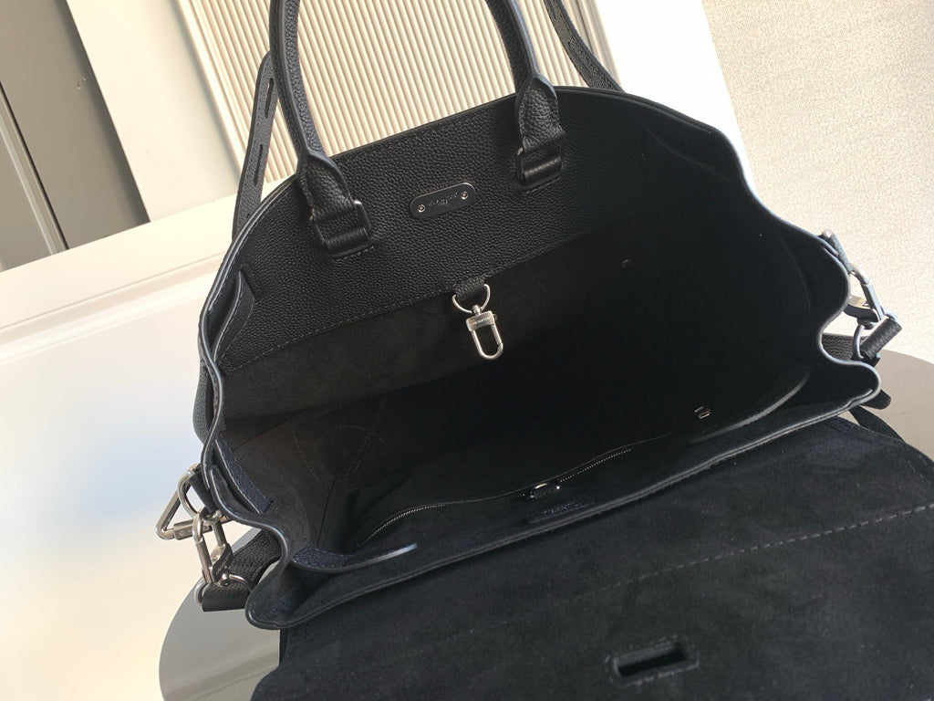 Men’s black leather handbag with front pocket and crossbody strap