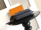 Rectangular crossbody bag in dark blue with monogram texture and long adjustable strap