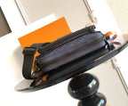 Dark blue monogram zip shoulder bag with crossbody strap and side pocket